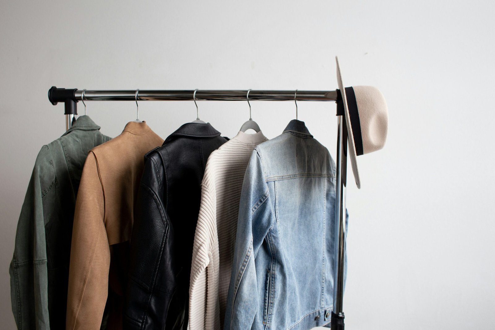 Spring jackets hanging on a stand.