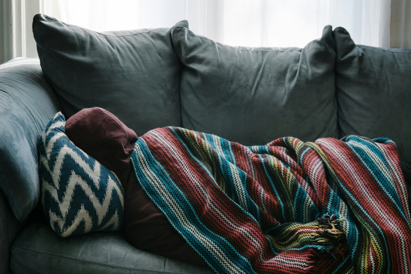 Someone napping on a comfy couch.