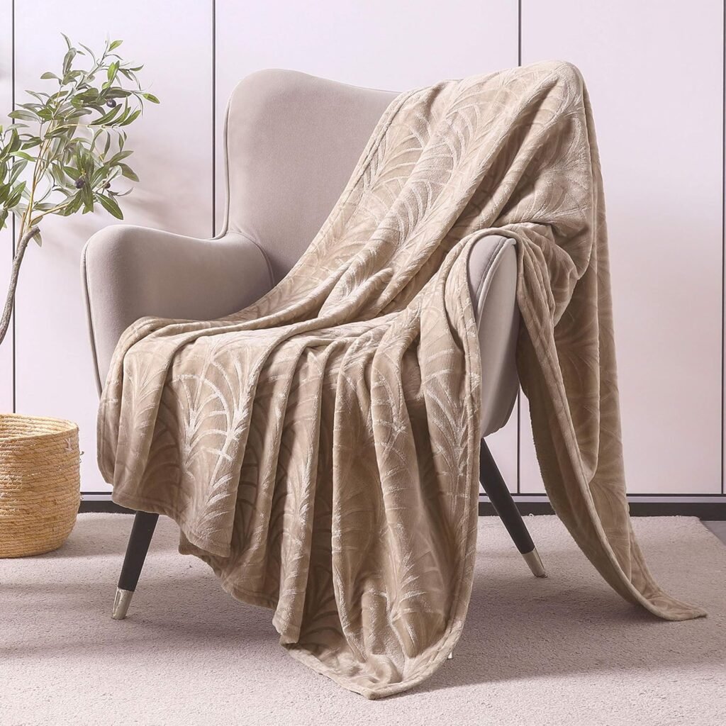 Whale Flotilla blanket styled over a living chair.