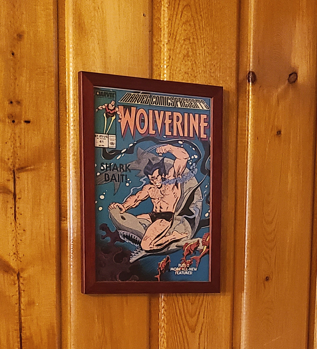 Framed Wolverine poster on wood panels